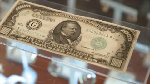 Billete de 1.000 dólares La casa de empeños